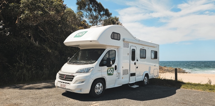 6 Berth Derwent Campervan by the beach during summer
