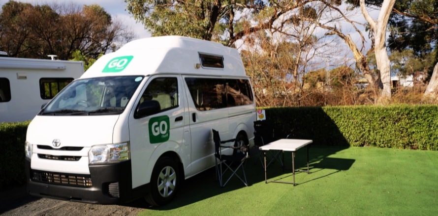 4 Berth Hi Top Campervan parked at a holiday park